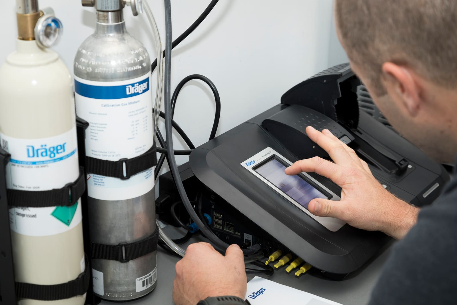 Gas cylinders and detection equipment at a calibration station