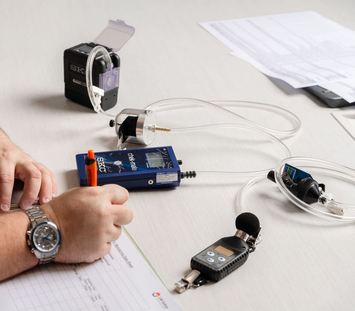Tabletop array of occupational hygiene sampling equipment ready for deployment